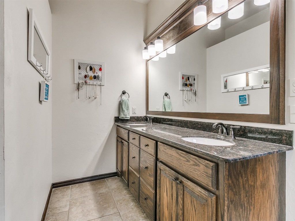 2409 Wayne Cutt Avenue, Yukon, OK 73099 bathroom featuring dual vanity and tile flooring