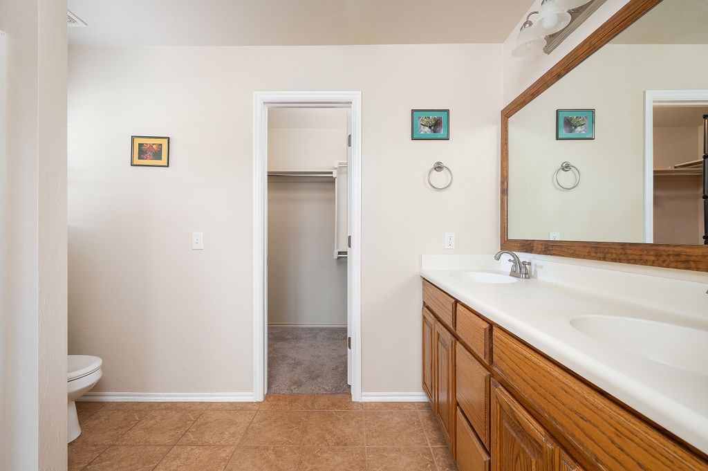 16420 Drywater Drive, Oklahoma City, OK 73170 bathroom with tile flooring, vanity, and a bathtub