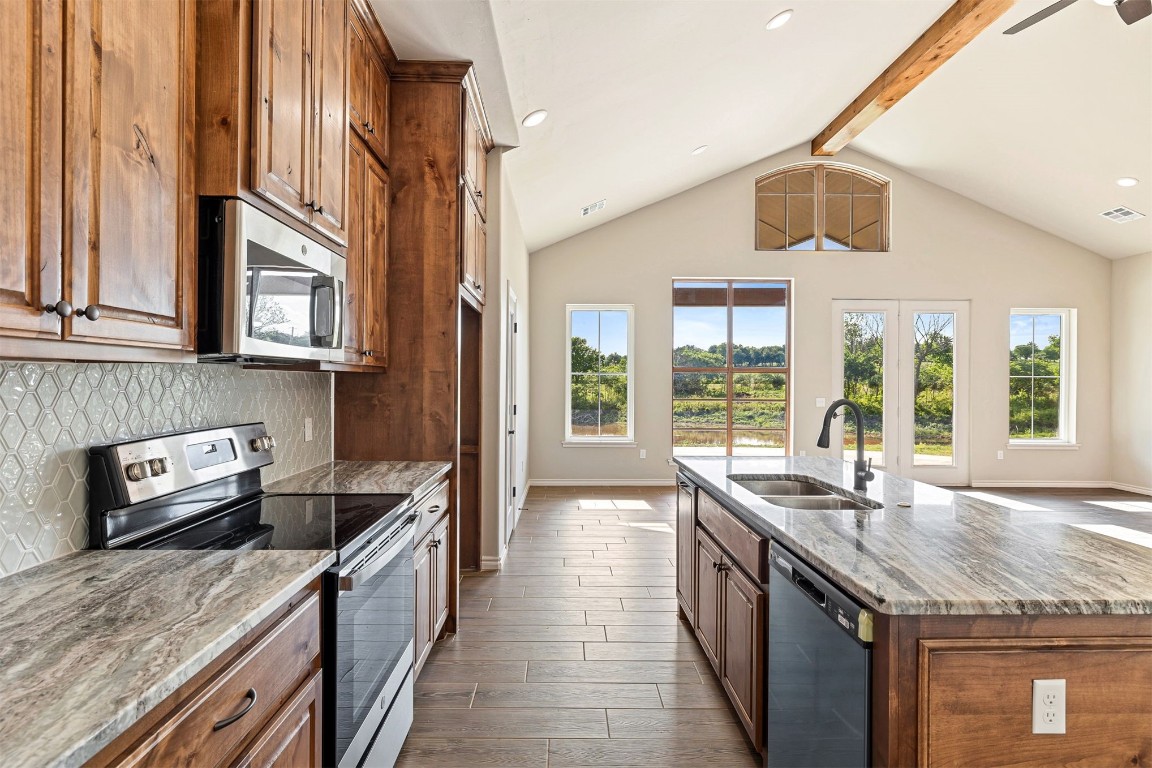 2268 S Murphys Ridge Road, Blanchard, OK 73010 kitchen featuring a healthy amount of sunlight, dark hardwood / wood-style flooring, stainless steel appliances, and sink