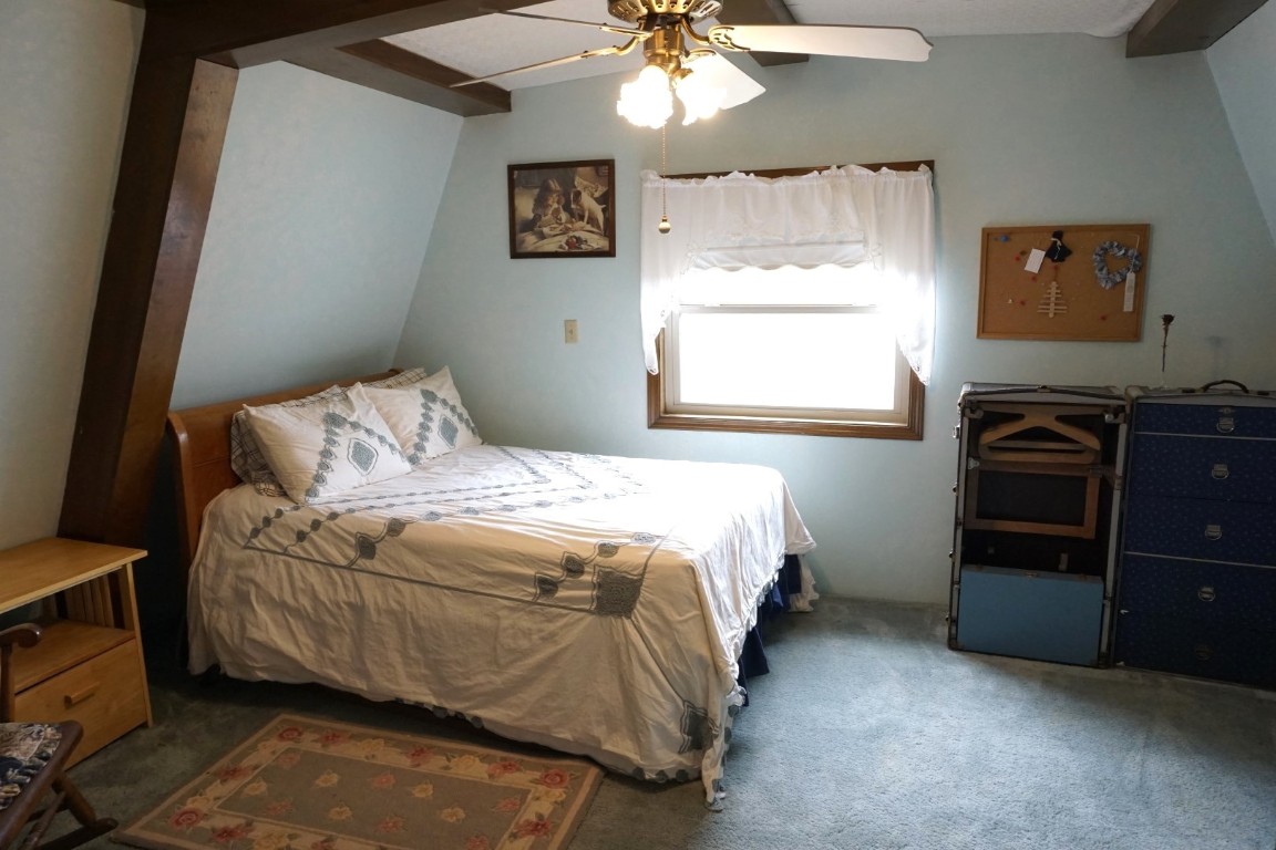 25550 County Road 110, Perry, OK 73077 carpeted bedroom featuring ceiling fan