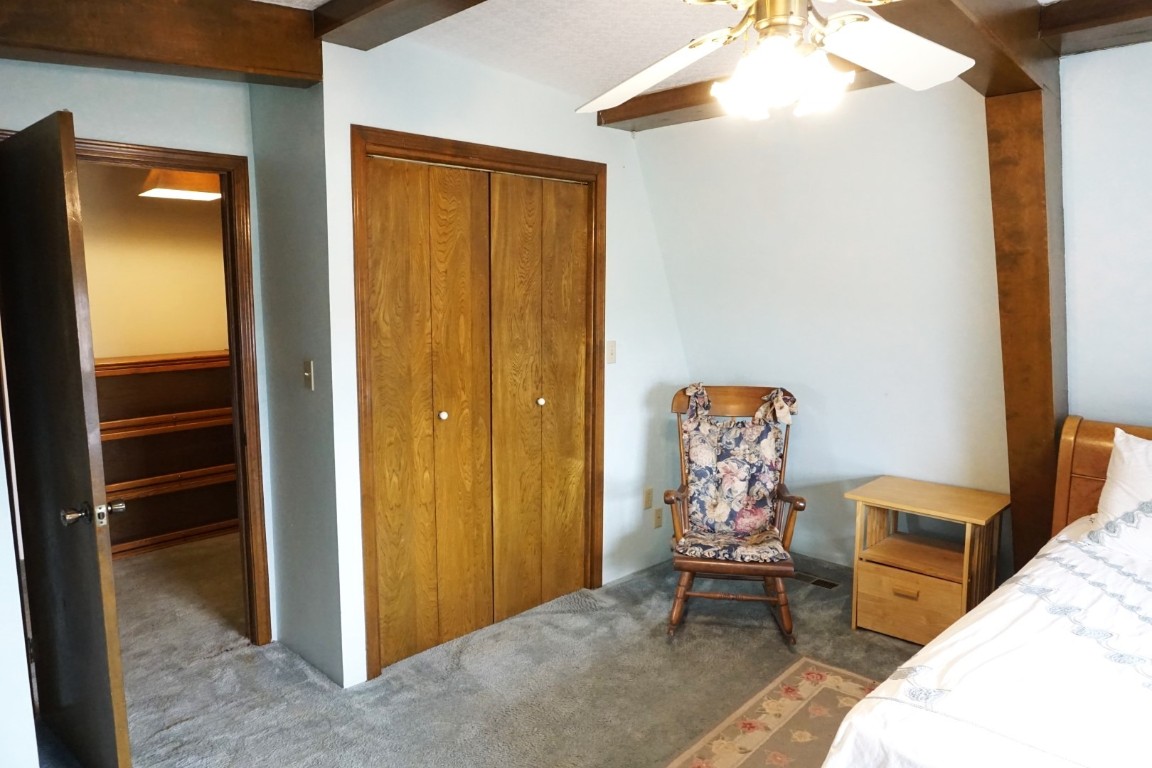 25550 County Road 110, Perry, OK 73077 bedroom with carpet flooring, a closet, and ceiling fan