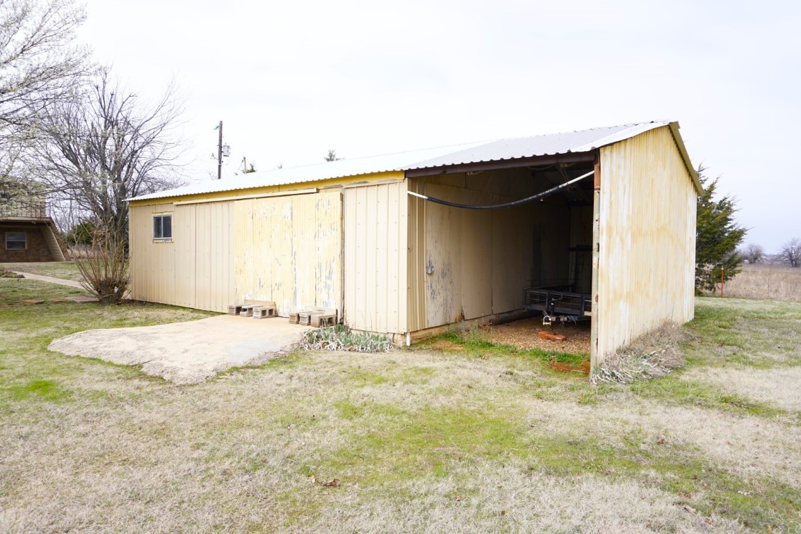 25550 County Road 110, Perry, OK 73077 view of outdoor structure with a lawn