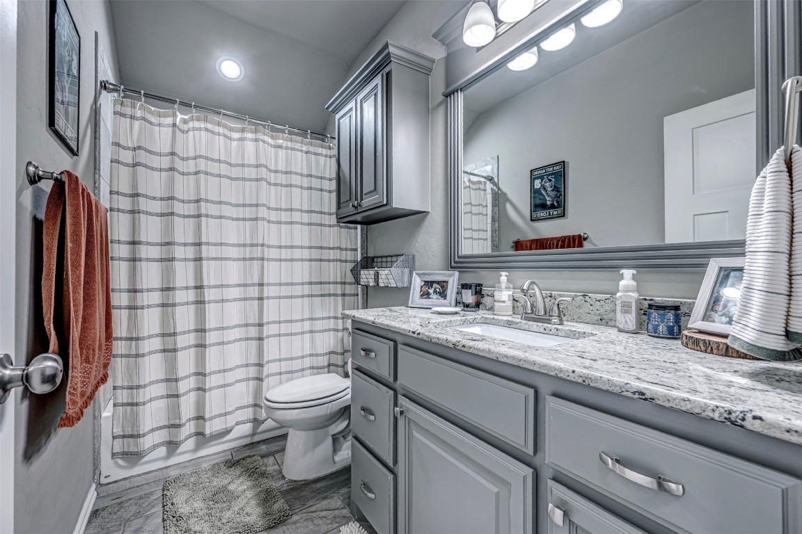 4112 Alnwick Lane, Oklahoma City, OK 73179 bathroom with toilet, tile flooring, and vanity