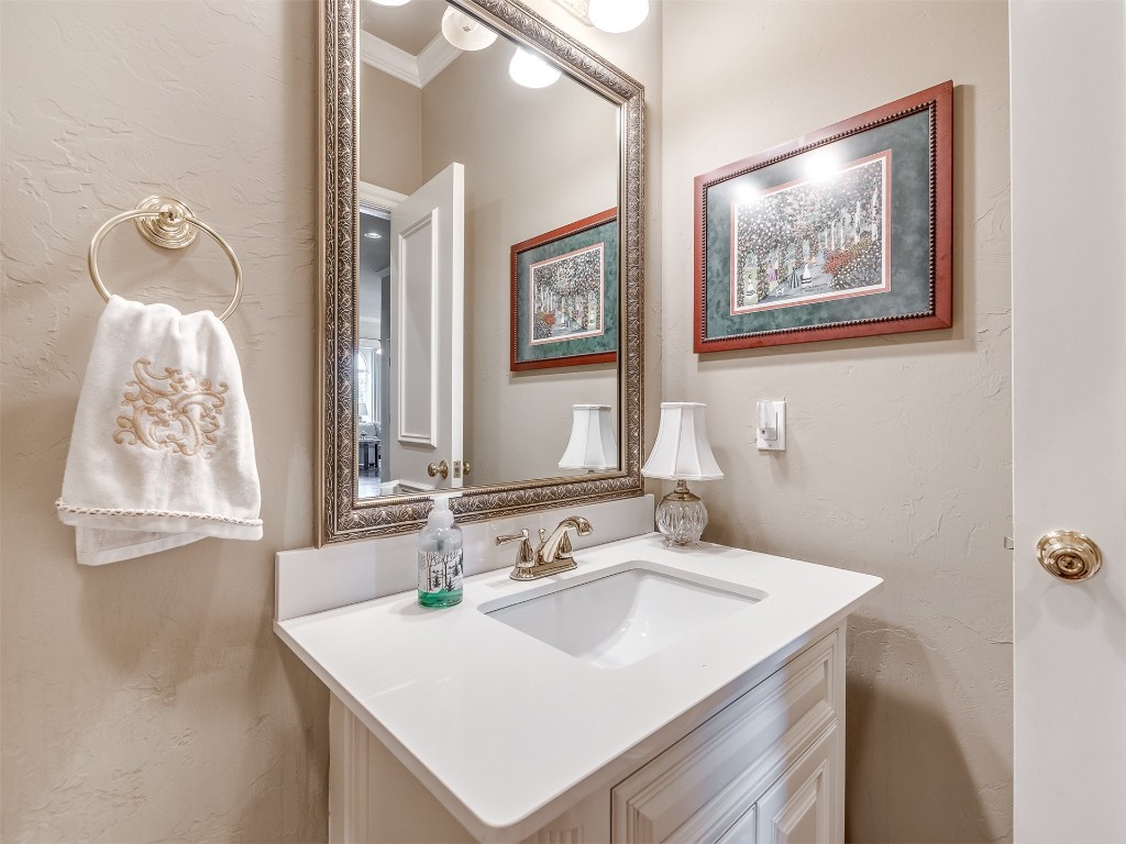 15608 Traditions Boulevard, Edmond, OK 73013 bathroom featuring vanity and ornamental molding