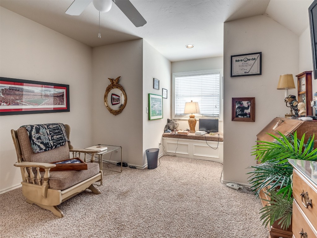 15608 Traditions Boulevard, Edmond, OK 73013 sitting room featuring vaulted ceiling, ceiling fan, and carpet