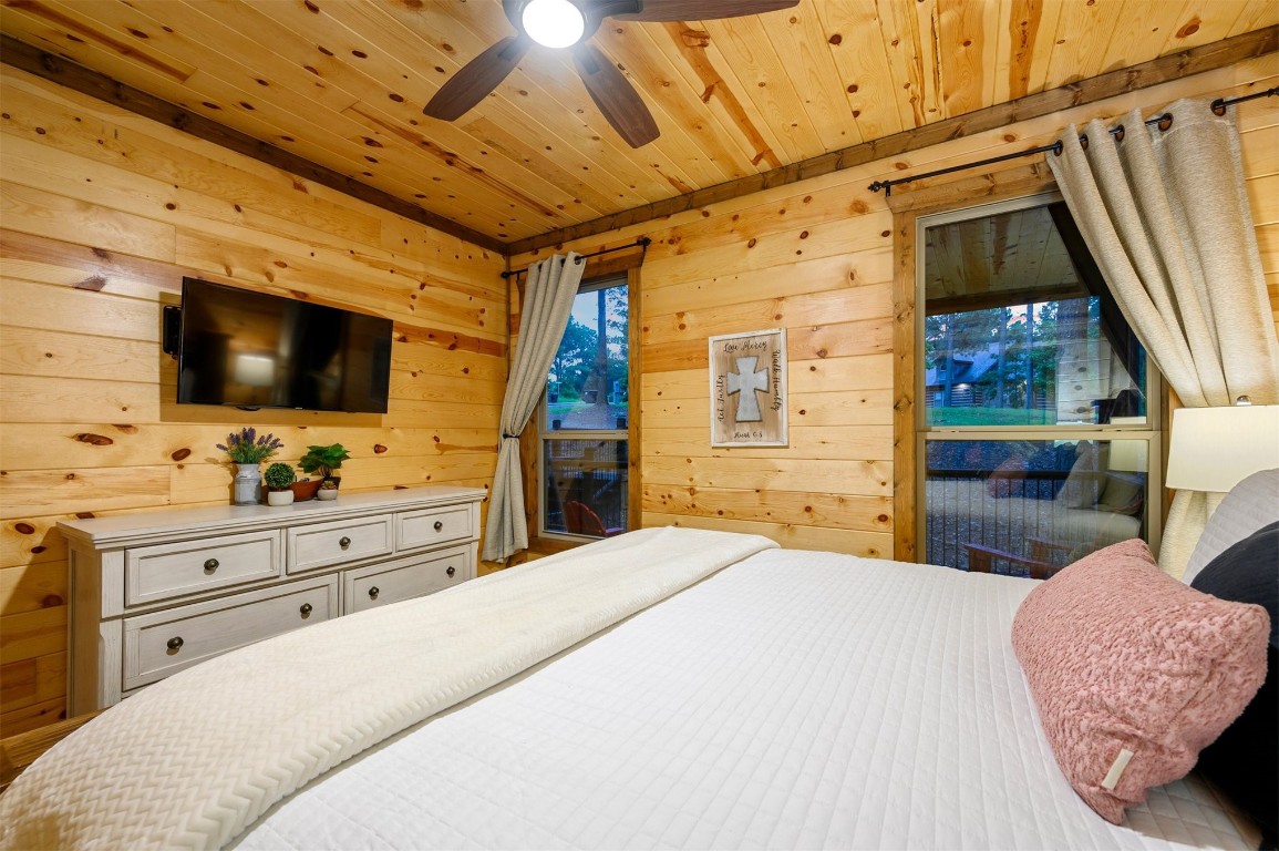 335 Mountain Pine Trail, Broken Bow, OK 74728 bedroom with wooden ceiling and ceiling fan