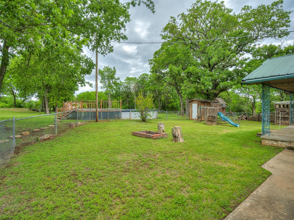 102199 S Highway 18, Meeker, OK 74855 view of yard with a playground and a storage unit