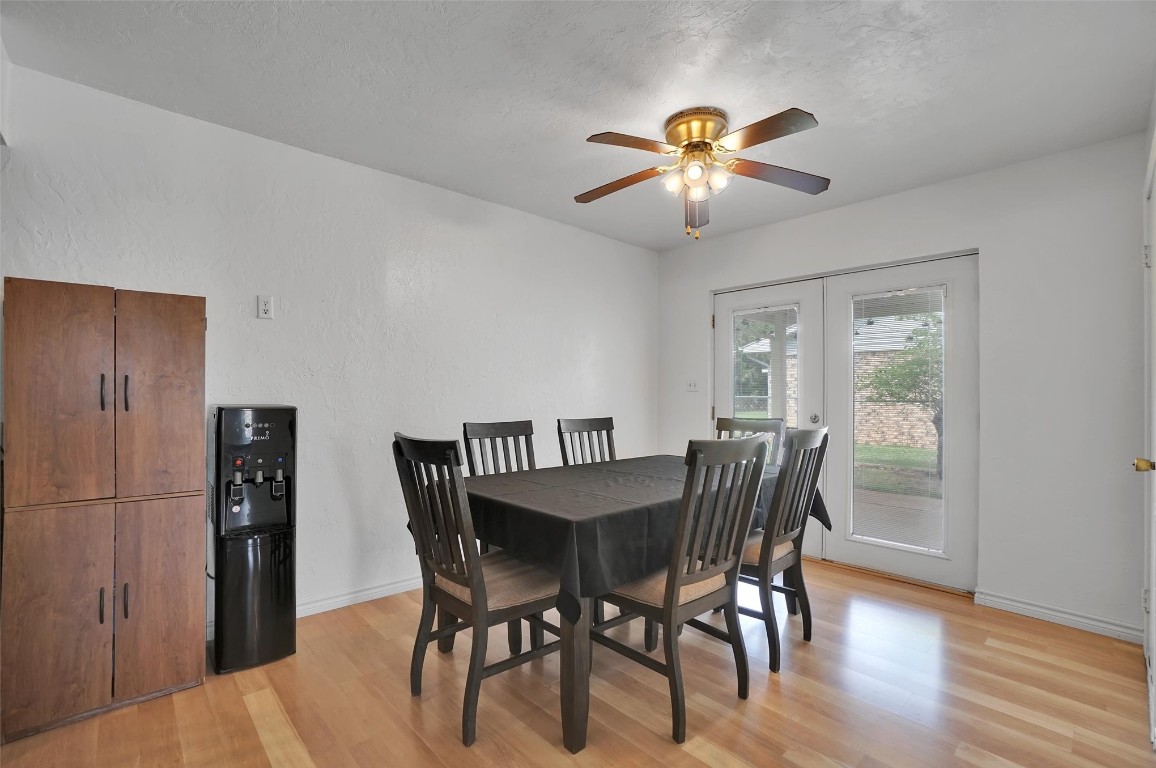 505 Libra Street, Altus, OK 73521 dining space with light hardwood / wood-style flooring, french doors, and ceiling fan