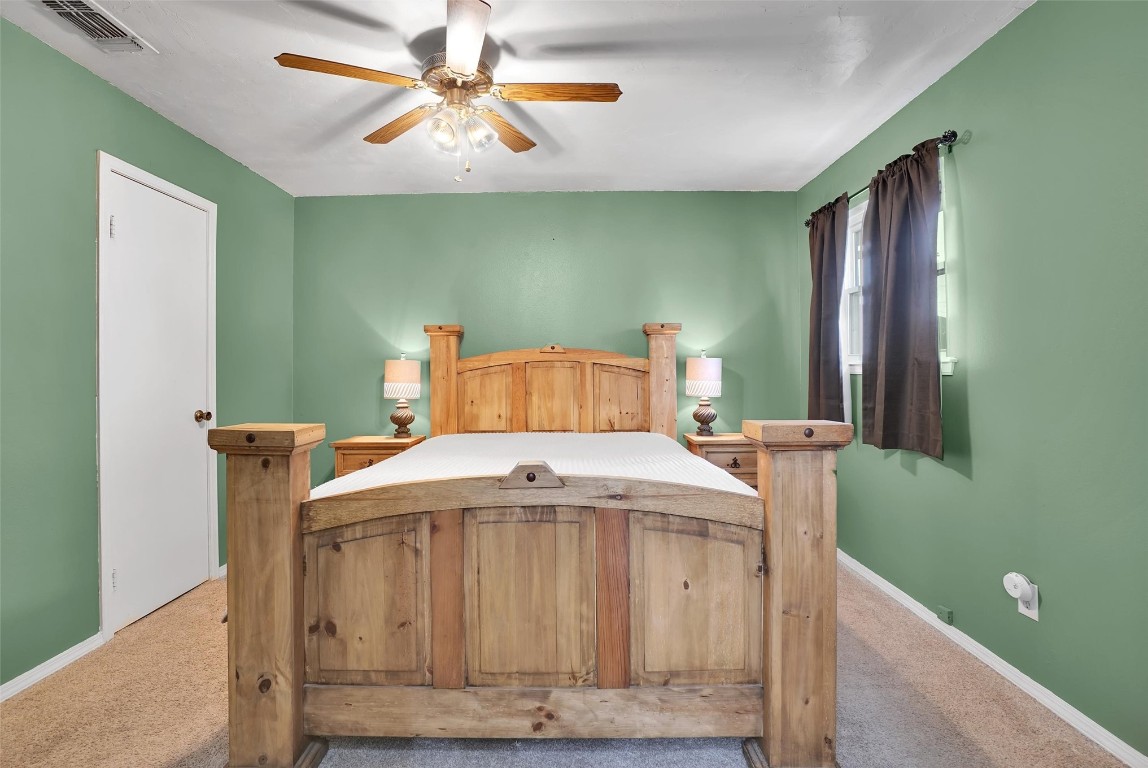 505 Libra Street, Altus, OK 73521 bedroom featuring ceiling fan and carpet flooring