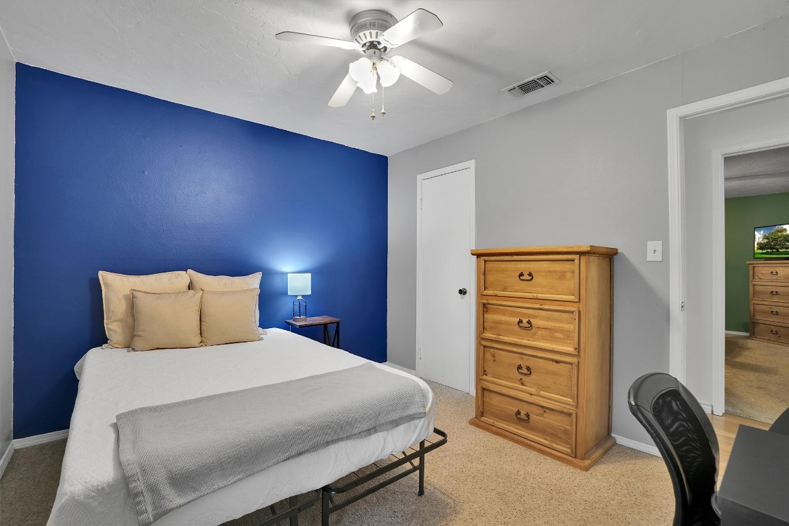 505 Libra Street, Altus, OK 73521 bedroom featuring ceiling fan and carpet