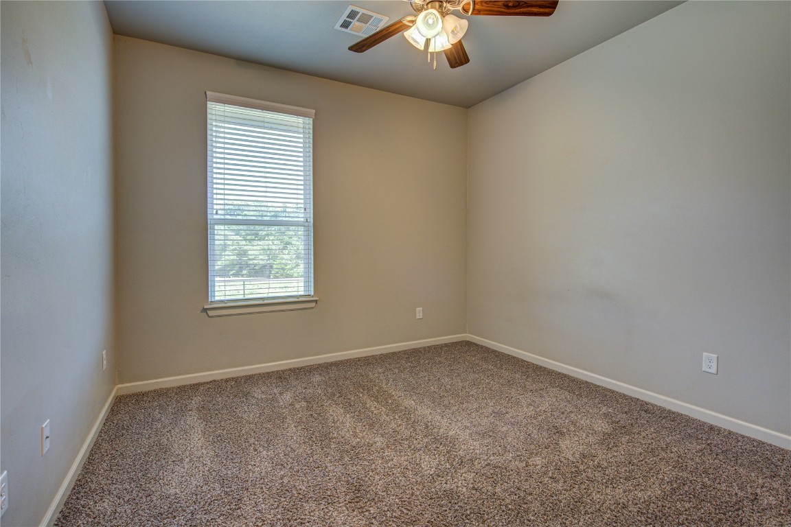 201 Casey Lane, Washington, OK 73093 spare room with ceiling fan and carpet