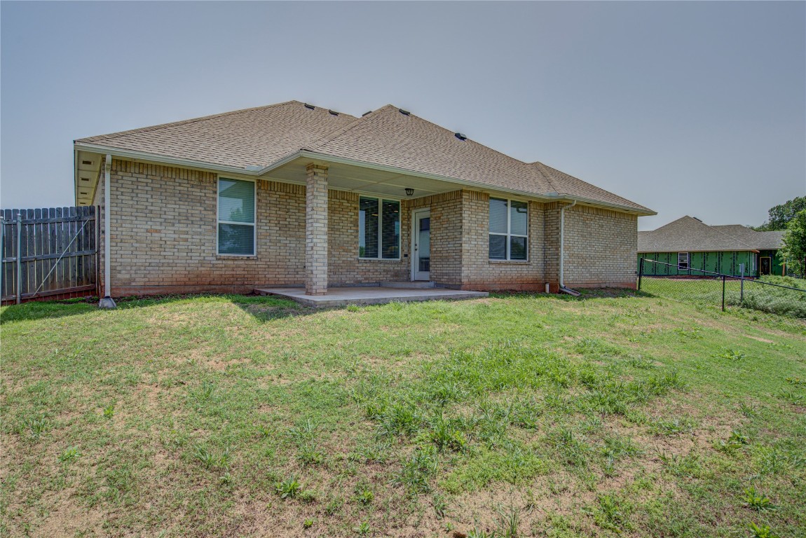 201 Casey Lane, Washington, OK 73093 back of house with a patio and a lawn