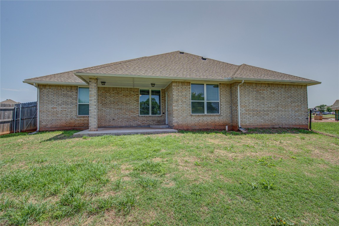 201 Casey Lane, Washington, OK 73093 rear view of property featuring a patio and a yard