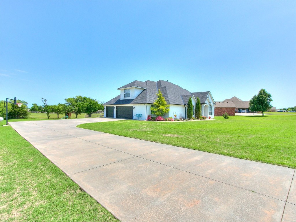 835 County Street 2922, Tuttle, OK 73089 cape cod home with a front yard and a garage