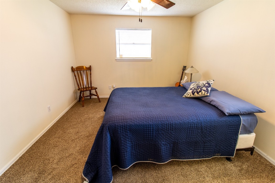 4704 Leslie Drive, Del City, OK 73115 carpeted bedroom with ceiling fan
