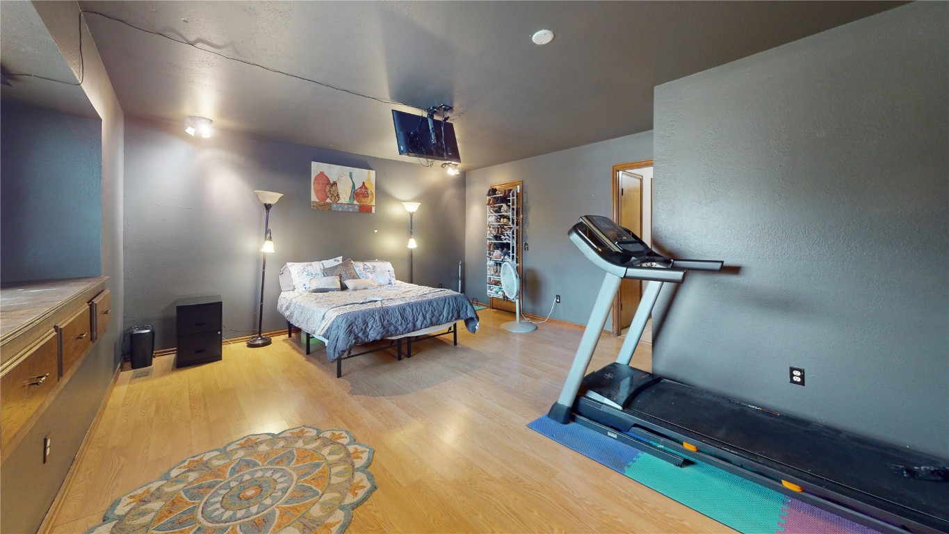 1217 SW 94th Street, Oklahoma City, OK 73139 bedroom with light hardwood / wood-style flooring