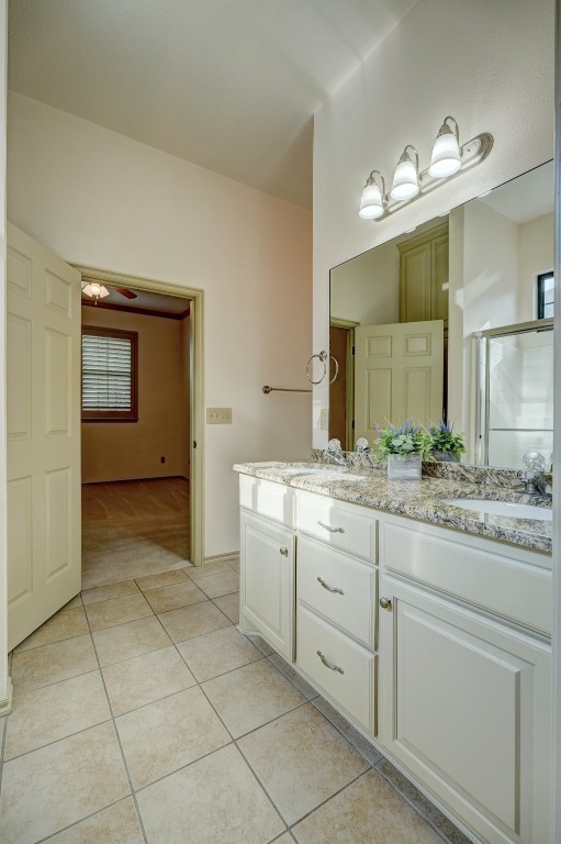 928 Heather Glen Terrace, Norman, OK 73072 bathroom featuring tile flooring, ceiling fan, and double sink vanity