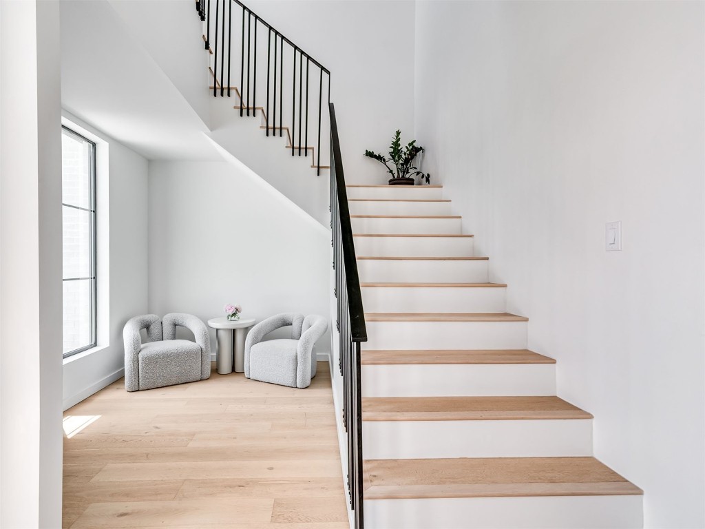 18320 108th Street, Lexington, OK 73051 stairway with light hardwood / wood-style floors