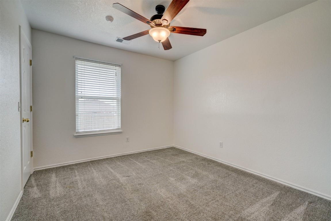 3509 Shona Way, Norman, OK 73069 unfurnished room with ceiling fan and carpet