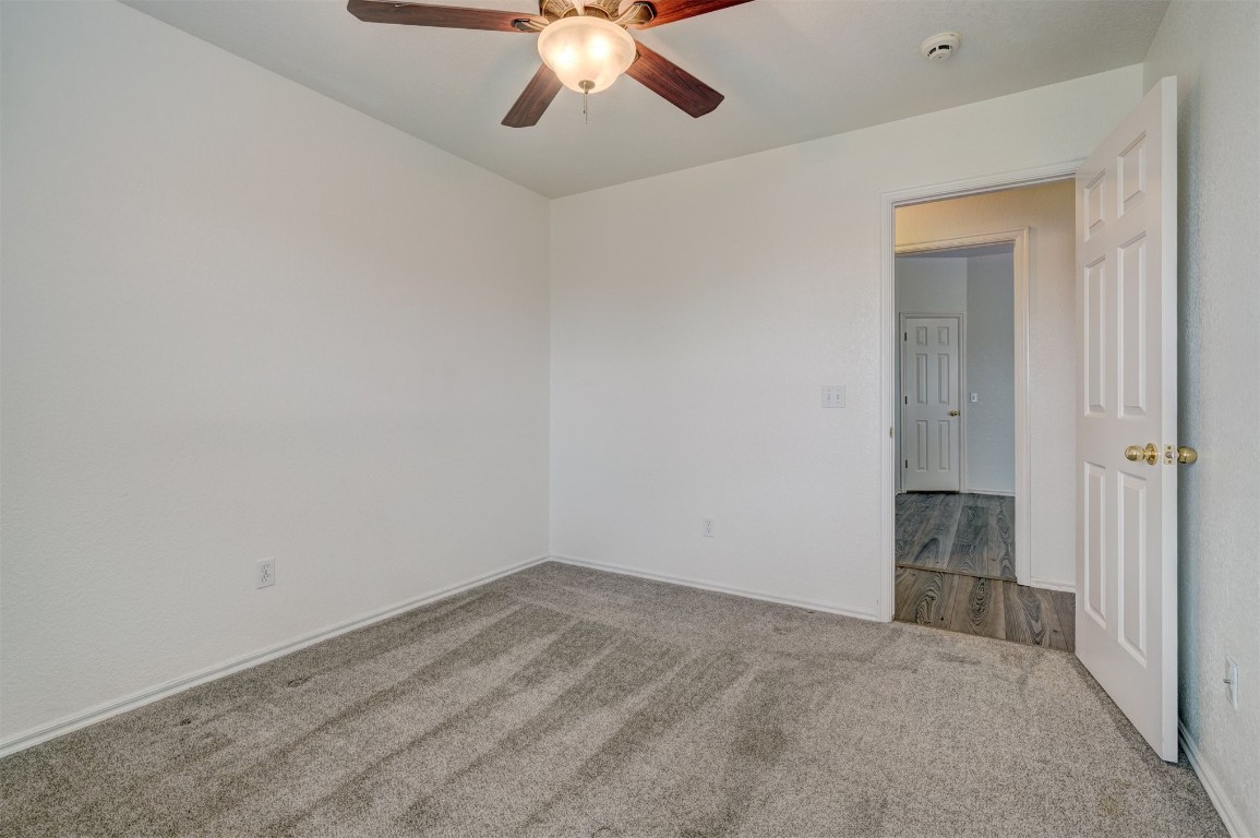 3509 Shona Way, Norman, OK 73069 unfurnished room with carpet floors and ceiling fan