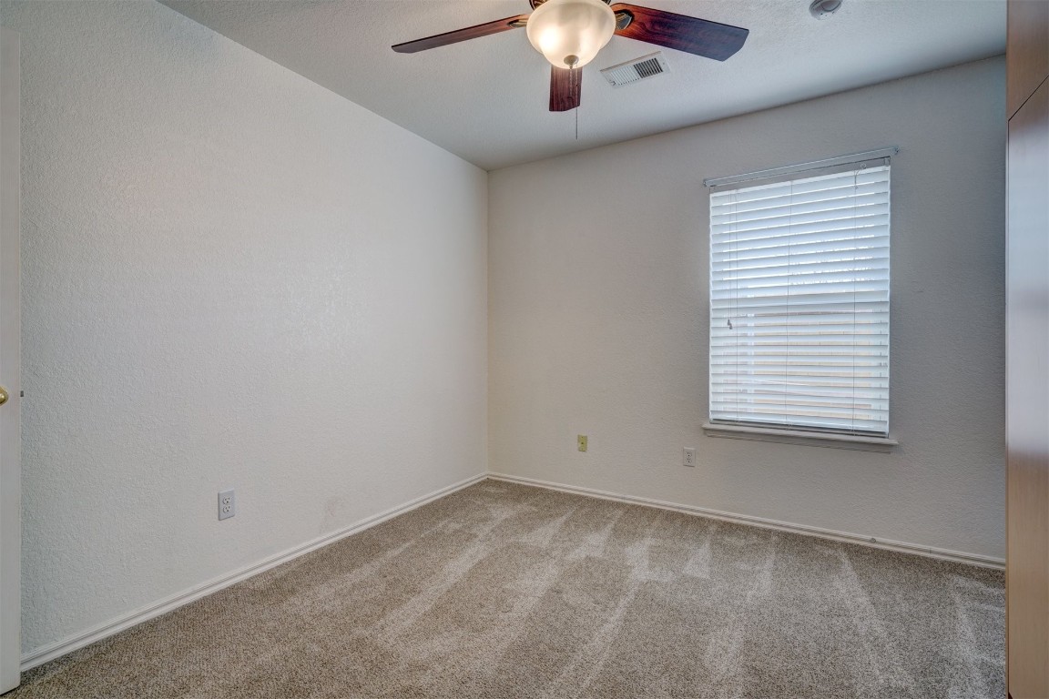 3509 Shona Way, Norman, OK 73069 unfurnished room with ceiling fan and carpet floors