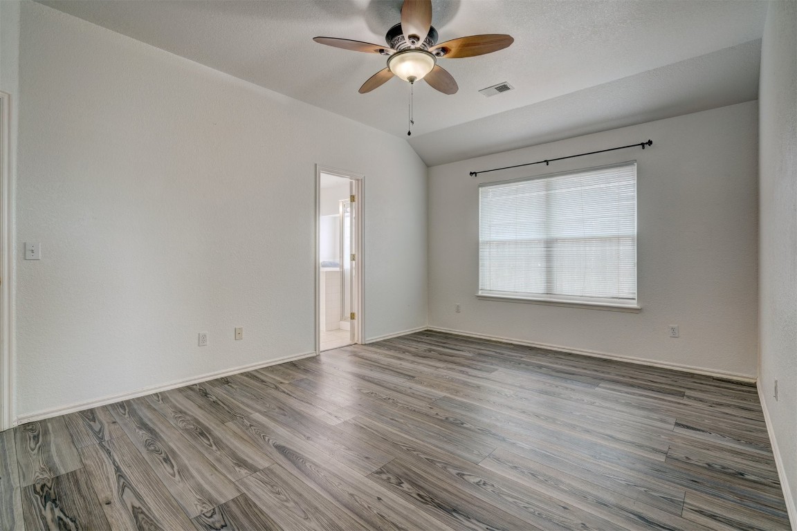 3509 Shona Way, Norman, OK 73069 unfurnished room with hardwood / wood-style floors and ceiling fan