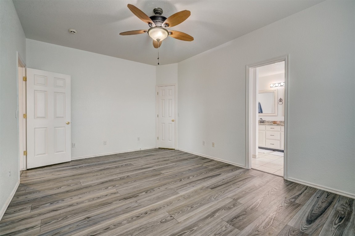 3509 Shona Way, Norman, OK 73069 empty room with wood-type flooring and ceiling fan