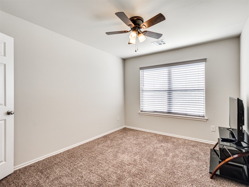 10009 Wessex Drive, Yukon, OK 73099 unfurnished room with carpet flooring and ceiling fan