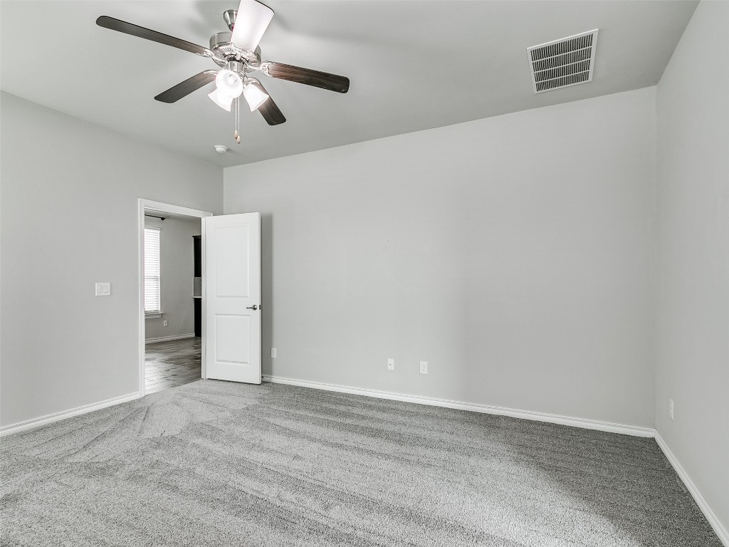 2508 Austin Glen Court, Yukon, OK 73099 spare room with ceiling fan and carpet