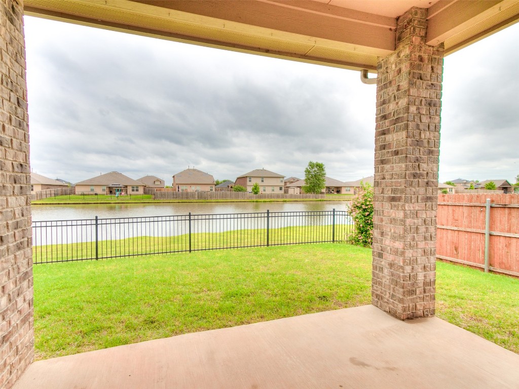 2508 Austin Glen Court, Yukon, OK 73099 view of yard featuring a patio area and a water view