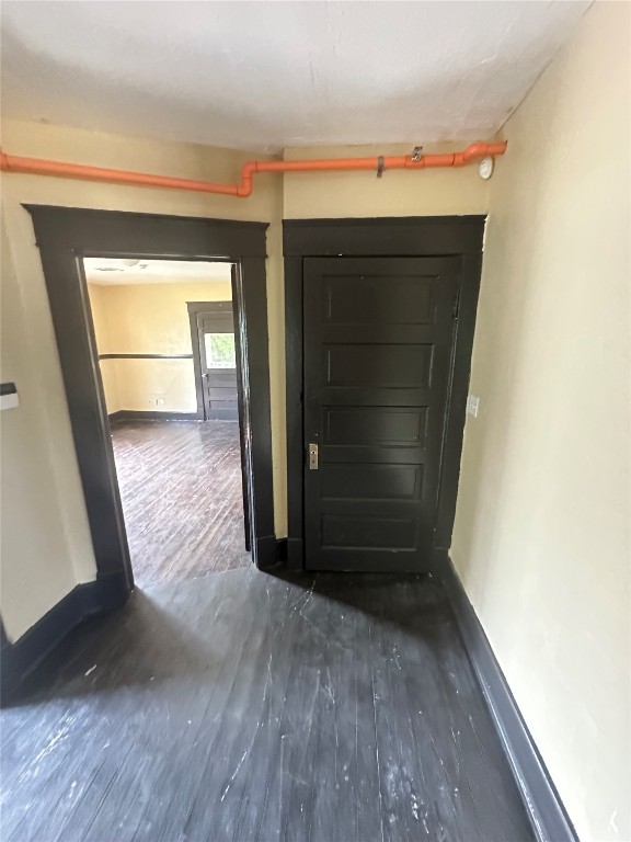 1304 NW 16th, Oklahoma City, OK 73106 doorway featuring dark wood-type flooring