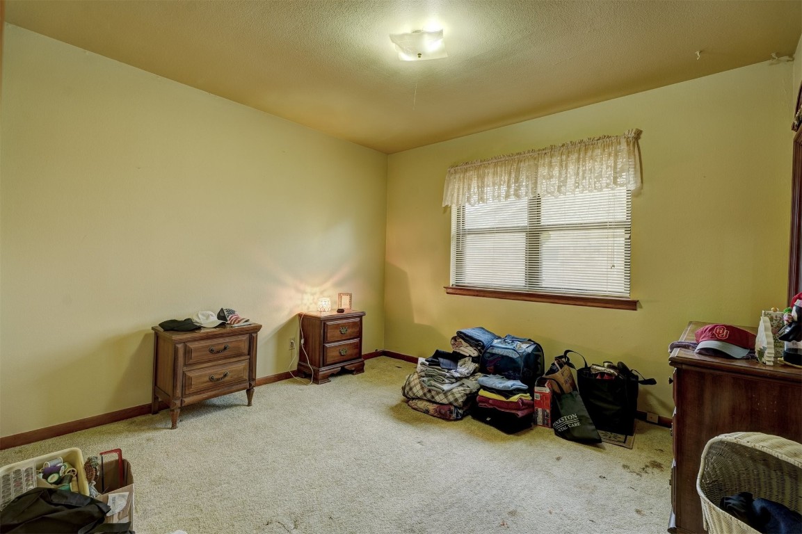 3809 NW 57th Street, Oklahoma City, OK 73112 misc room featuring carpet
