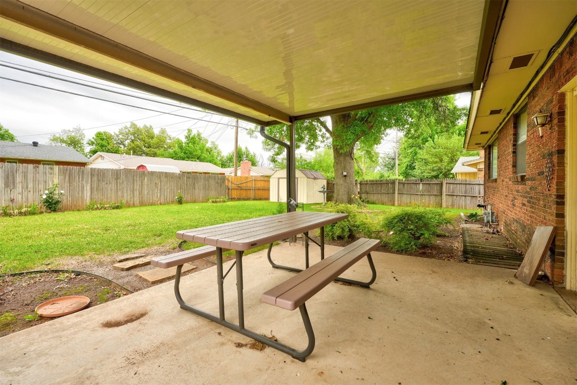 3809 NW 57th Street, Oklahoma City, OK 73112 view of patio / terrace featuring a shed