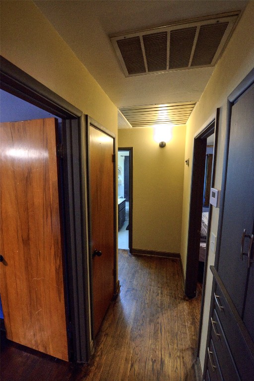 717 W Washington Street, Purcell, OK 73080 hallway featuring dark hardwood / wood-style floors