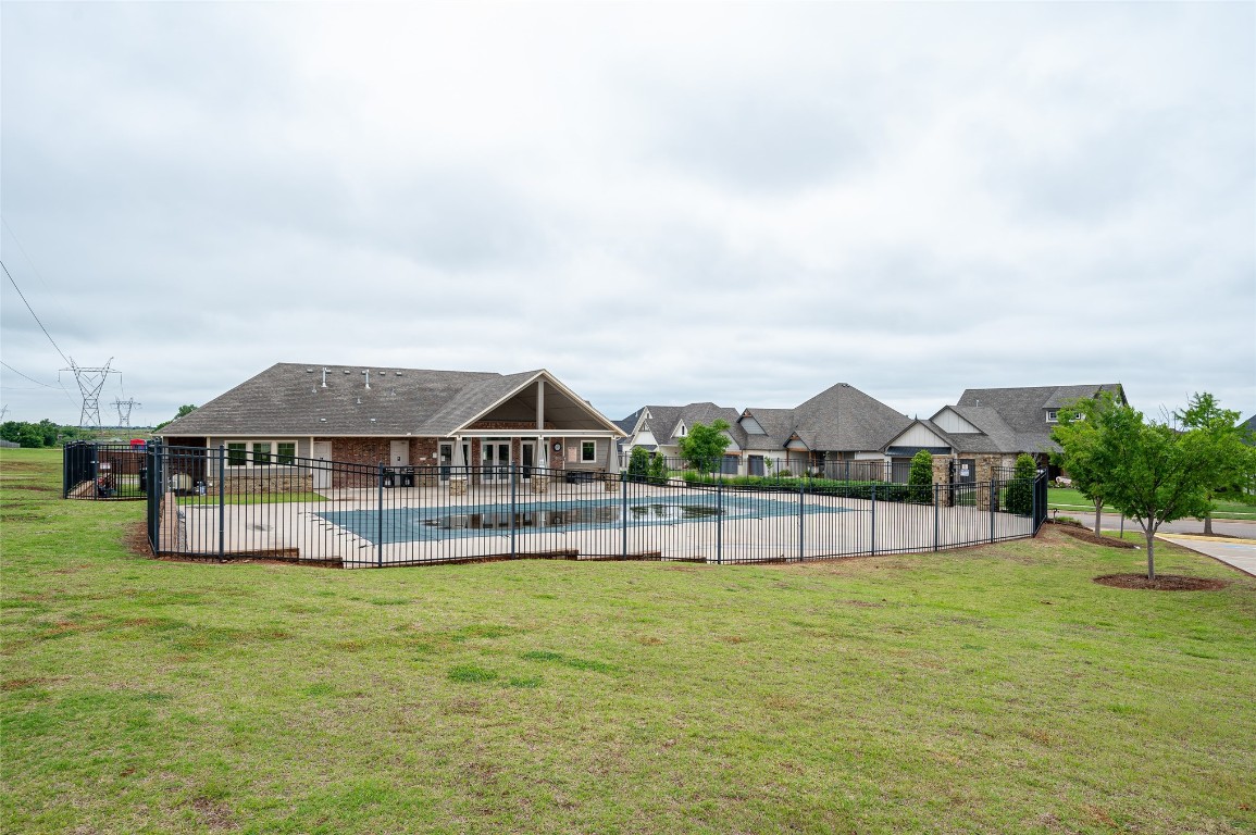 14709 Chambord Drive, Yukon, OK 73099 view of yard with a fenced in pool