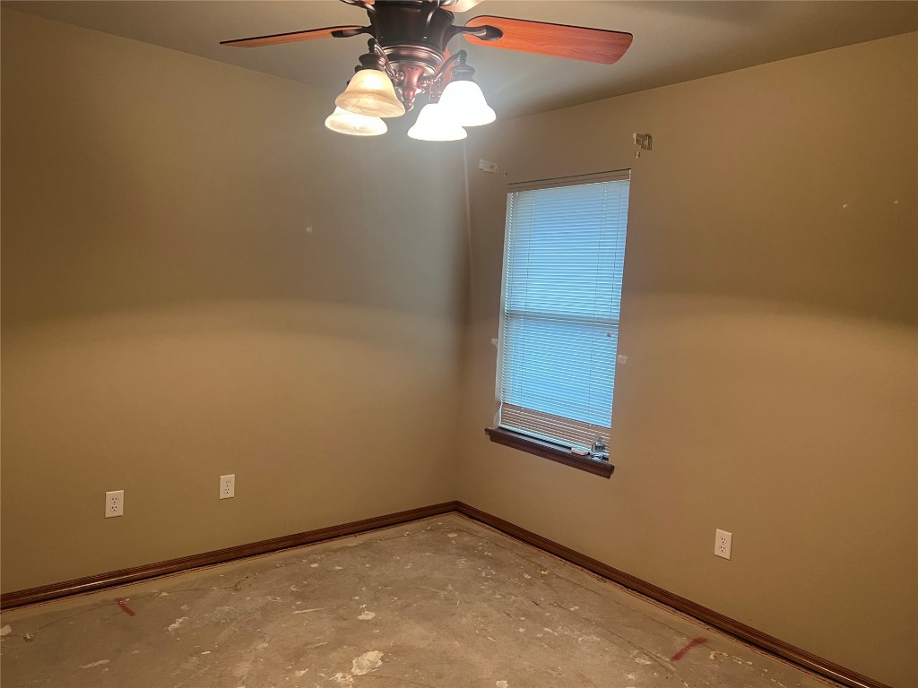 517 Hutton Road, Yukon, OK 73099 empty room featuring ceiling fan and concrete floors