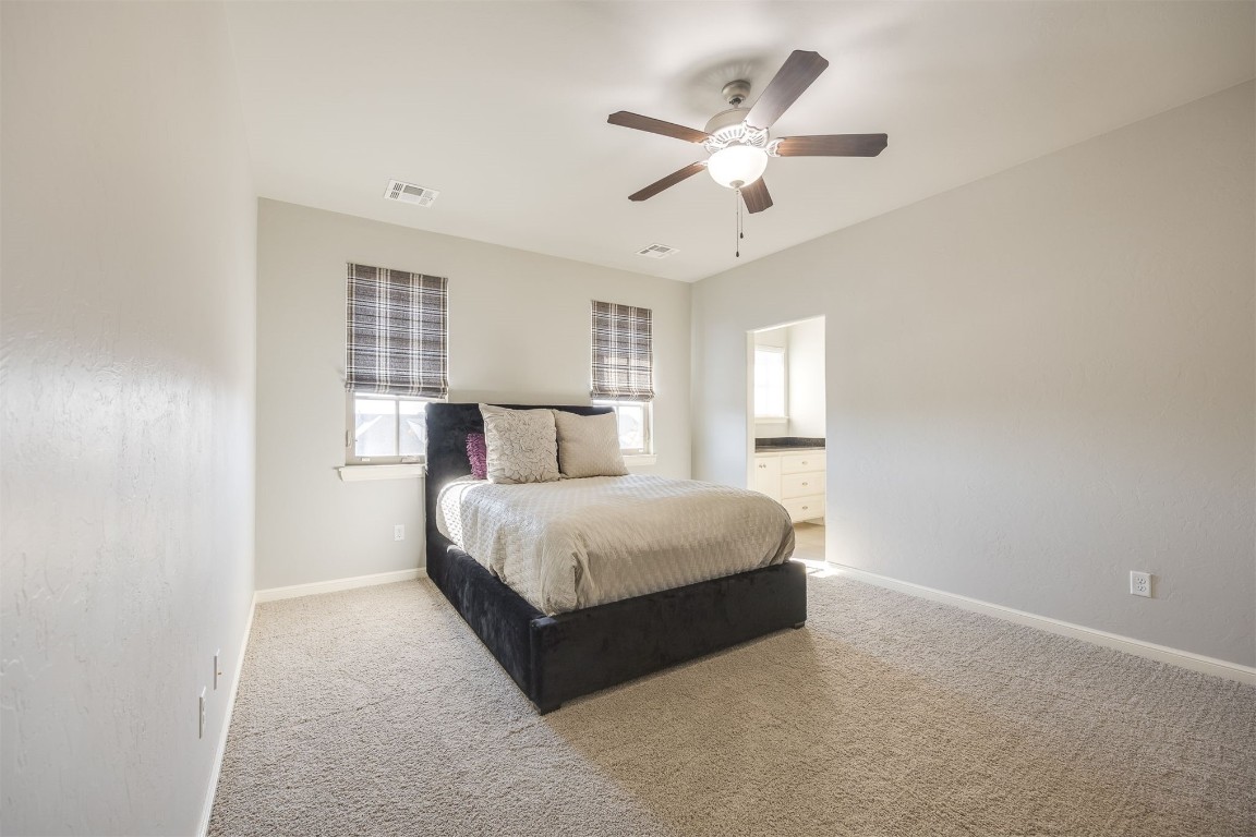 6332 Wentworth Drive, Edmond, OK 73025 bedroom with carpet and ceiling fan