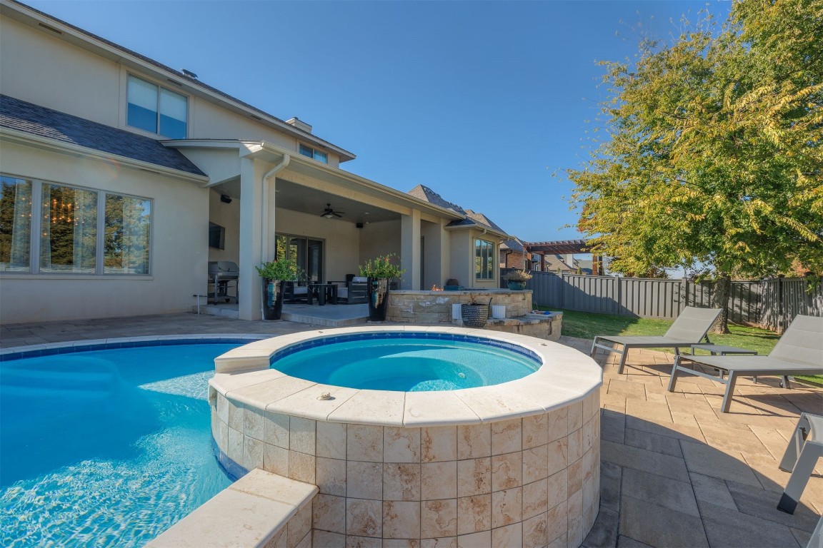 6332 Wentworth Drive, Edmond, OK 73025 view of pool with a patio area, a grill, ceiling fan, and an in ground hot tub