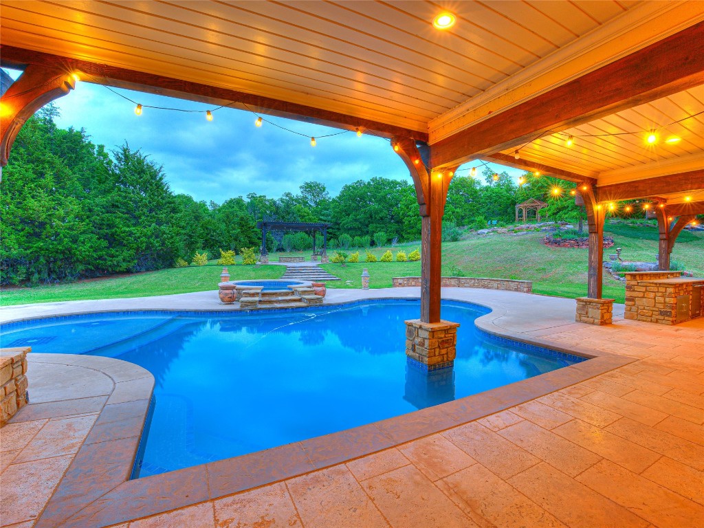 3624 Winding Lake Circle, Arcadia, OK 73007 view of pool featuring a patio and a lawn