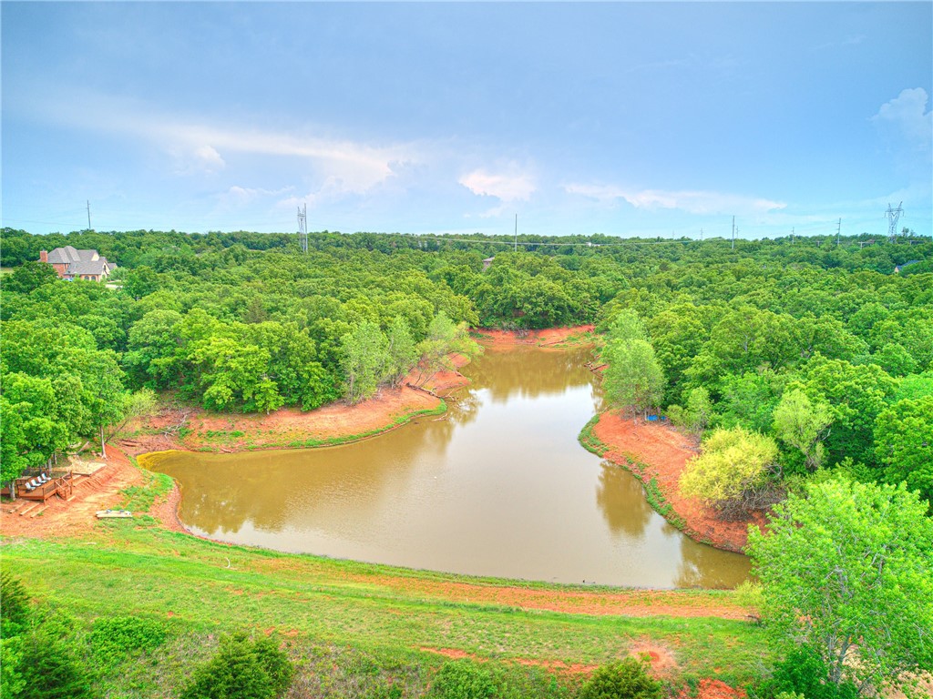 3624 Winding Lake Circle, Arcadia, OK 73007 drone / aerial view with a water view