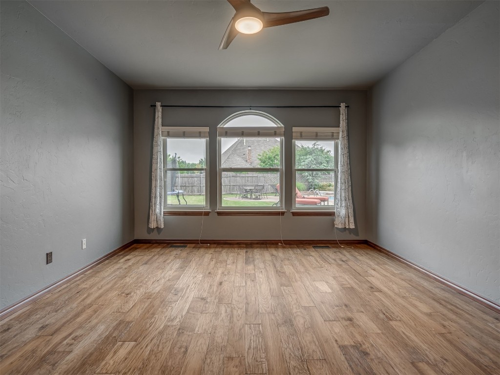 1517 SW 132nd Street, Oklahoma City, OK 73170 spare room featuring ceiling fan and light hardwood / wood-style floors