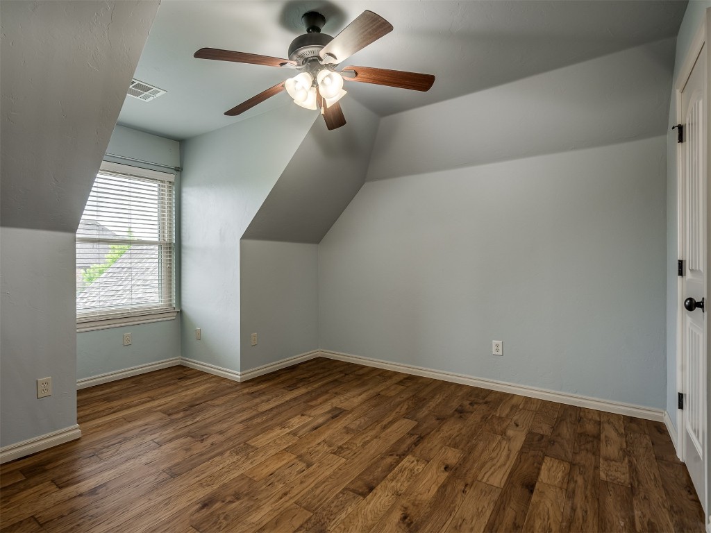 1517 SW 132nd Street, Oklahoma City, OK 73170 bonus room featuring hardwood / wood-style flooring, ceiling fan, and vaulted ceiling