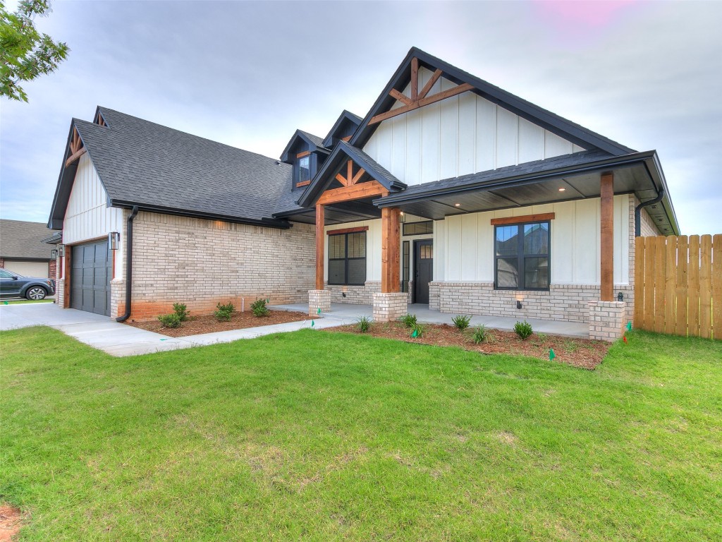 500 Carlow Way, Yukon, OK 73099 craftsman-style home featuring covered porch, central AC unit, and a front lawn
