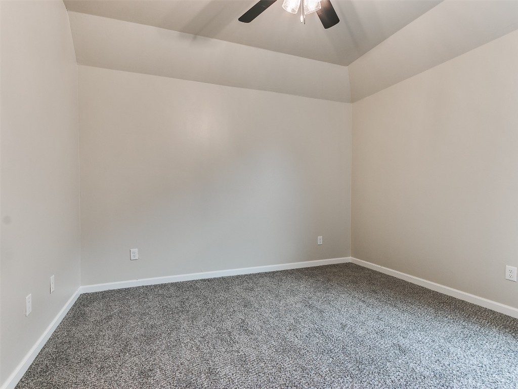 500 Carlow Way, Yukon, OK 73099 empty room with ceiling fan and a tray ceiling
