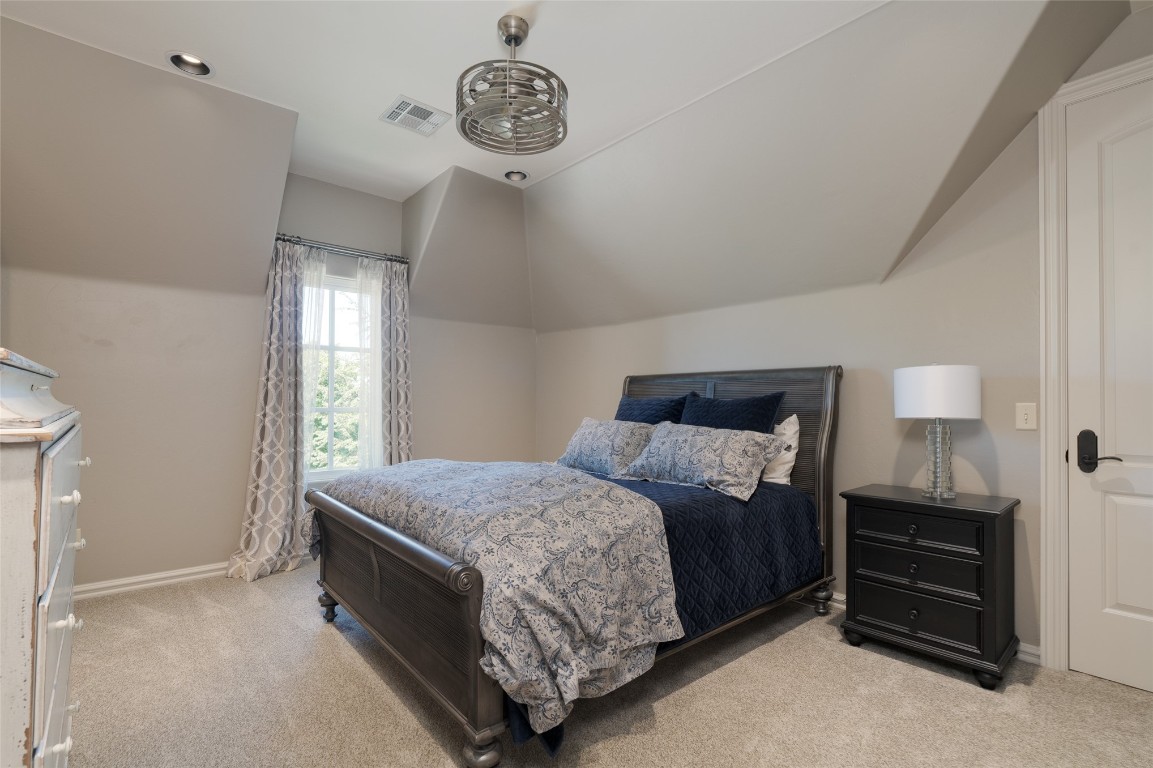 1200 Settlers Drive, Edmond, OK 73034 carpeted bedroom with lofted ceiling
