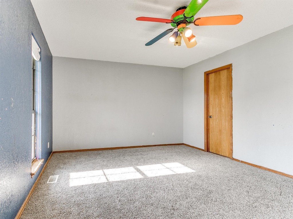 613 Cactus Court, Yukon, OK 73099 spare room with ceiling fan and carpet floors