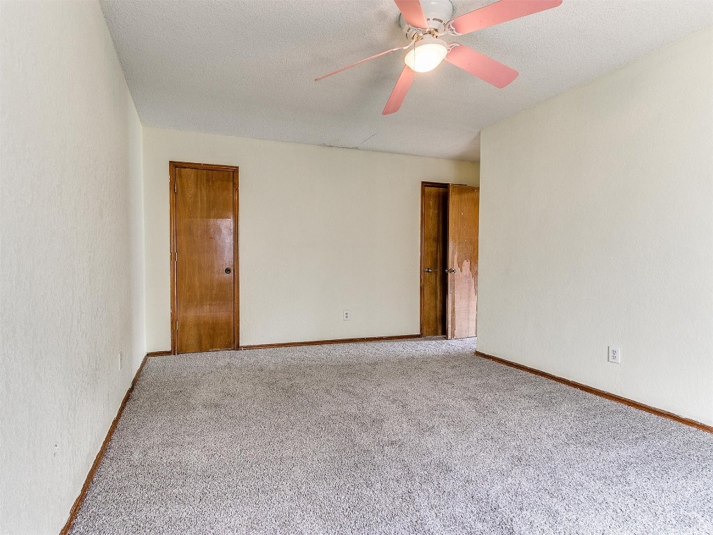 613 Cactus Court, Yukon, OK 73099 spare room featuring ceiling fan and carpet