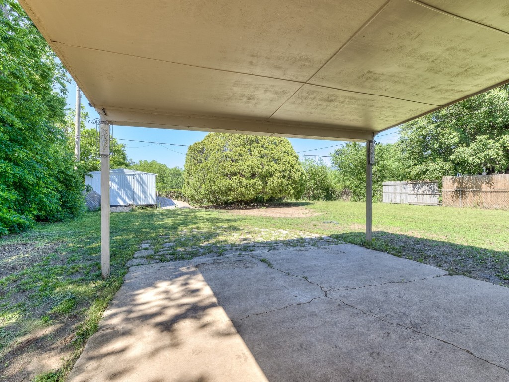 427 W Fairchild Drive, Midwest City, OK 73110 view of terrace featuring a storage unit