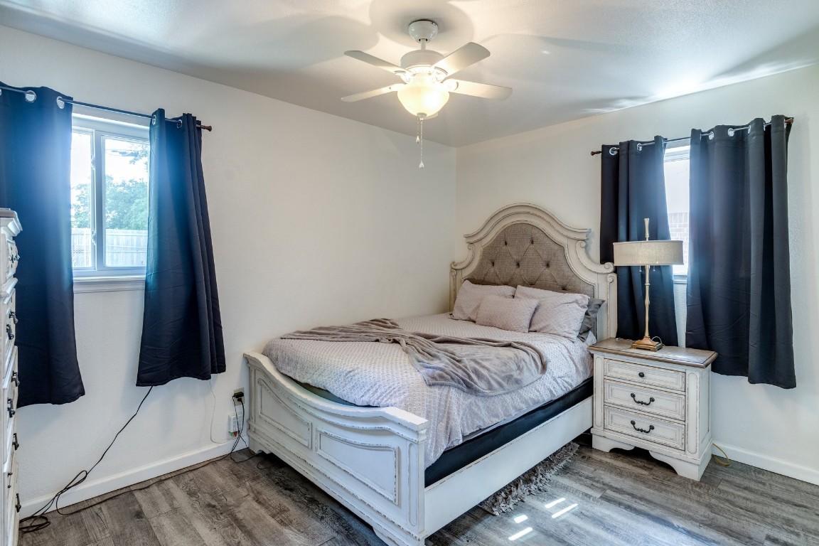 2709 SW 65th Street, Oklahoma City, OK 73159 bedroom featuring ceiling fan and hardwood / wood-style floors