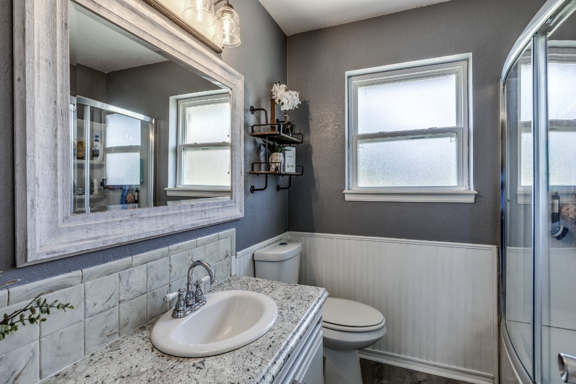 2709 SW 65th Street, Oklahoma City, OK 73159 bathroom with vanity with extensive cabinet space and toilet